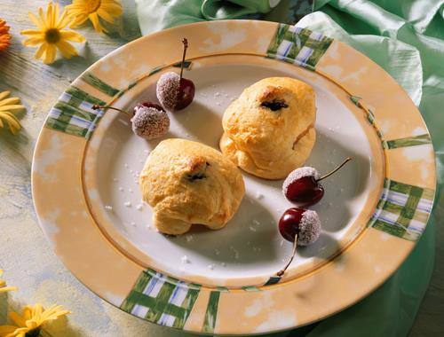 Überbackene Pfirsiche mit Topfenhaube